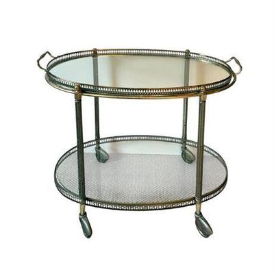 Lot 099   
Mid Century Modern Brass and Glass Oval Serving Trolley