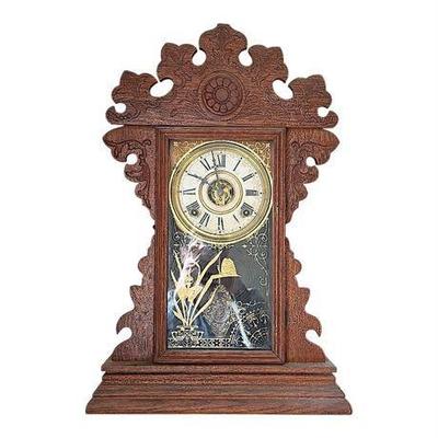 Lot 050-302  
Antique Welch Gingerbread Eight-Day, Half-Strike Mantle Clock