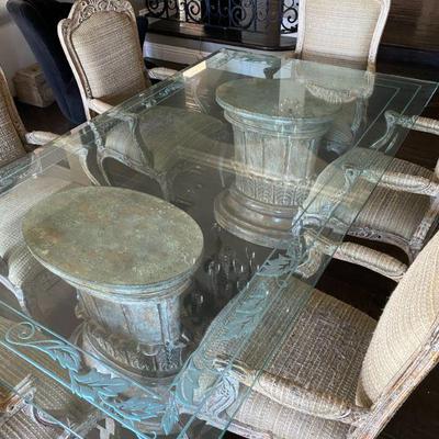 Engraved etched glass top dining table.