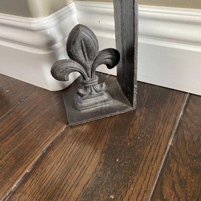 Fluer de lis iron door stop.