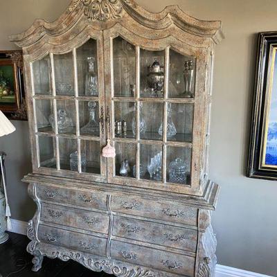 ROCOCO influenced distressed finish china cabinet.