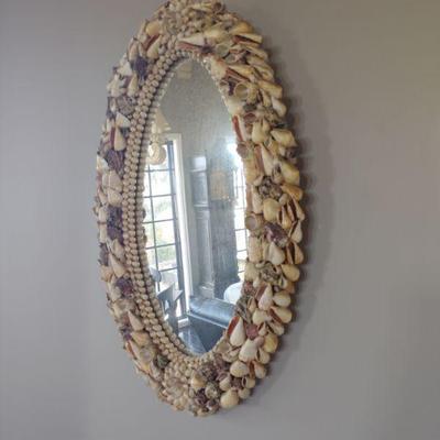 Shell-encrusted wall mirror.
17w x 28 tall
