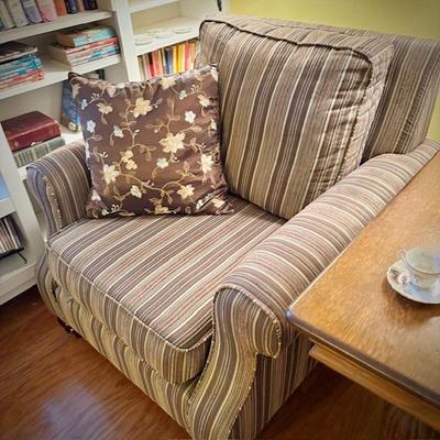 Second of two deep armchairs