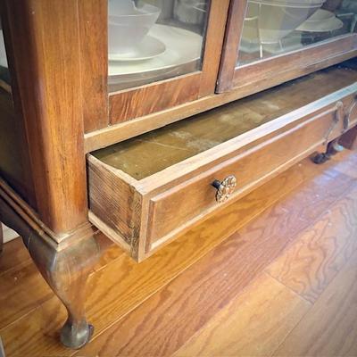 Antique glass china cabinet with bottom drawer, filled with MCM Rosenthal-Continental "Crystalline Blue" china set