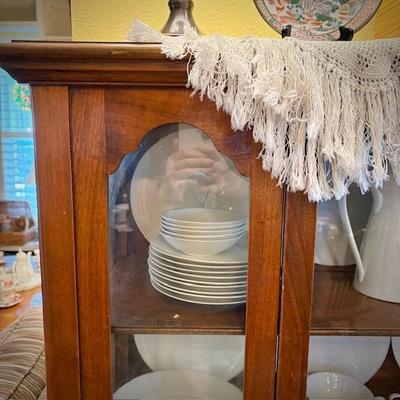 Antique glass china cabinet with bottom drawer, filled with MCM Rosenthal-Continental "Crystalline Blue" china set
