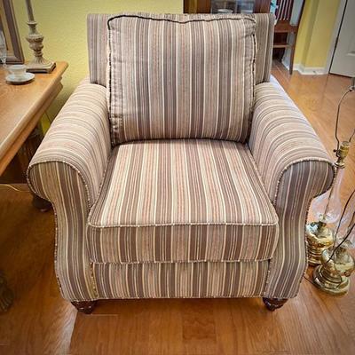 One of two deep armchairs