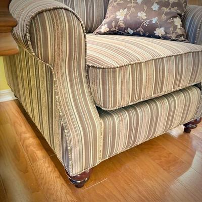 One of two deep armchairs