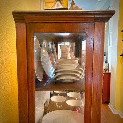 Antique glass china cabinet with bottom drawer, filled with MCM Rosenthal-Continental "Crystalline Blue" china set
