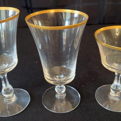 Gold Rimmed Glassware And Plates Missing One Glass And One Plate
