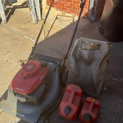 Honda Easy Start High Performance Lawn Mower And Gas Cans
