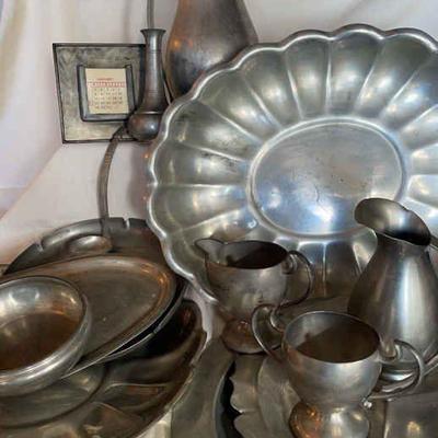 Mix of cool pewter serving and decor items