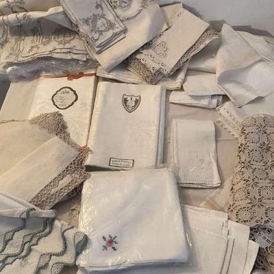 Large collection of ivory linens some to repurpose