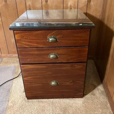 Three drawer glass top office table with filedrawer