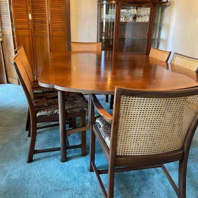 Drexel heritage dining table with leaf and 6 cane backed chairs