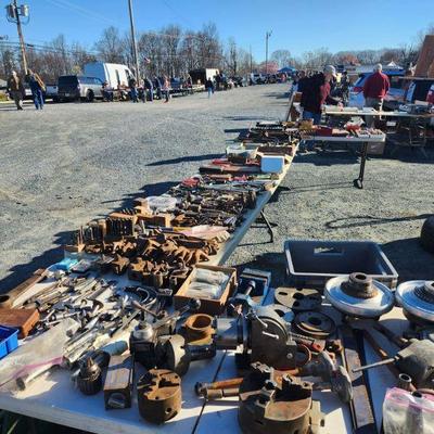 Many tailgaters selling tools and goods outside