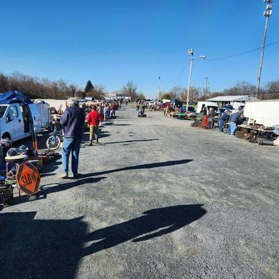 Many tailgaters selling tools and goods outside