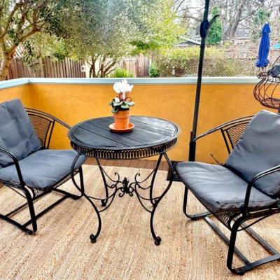 Wrought iron deck chairs and table