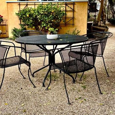 Wrought iron patio table and 4 chairs