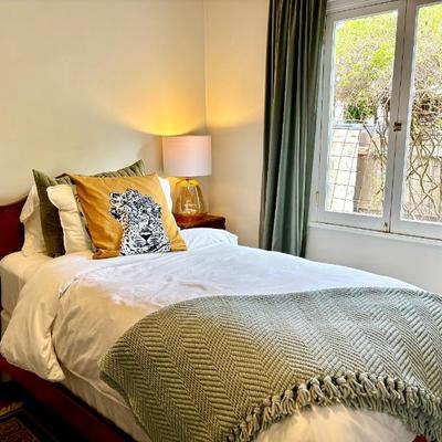 One of 2 antique beds and linens
