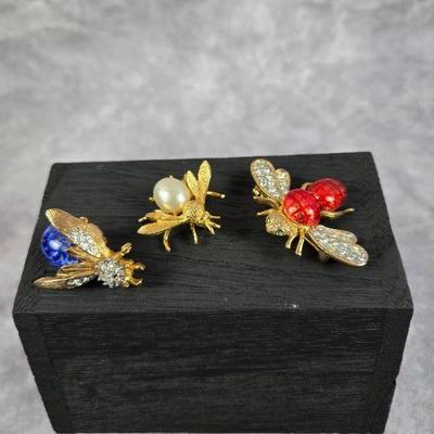 A bunch of bee brooches