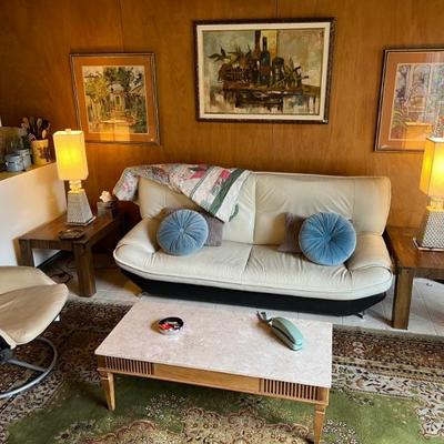 Beautiful Italian leather couch, tufted vintage pillows, travertine MCM coffee table, MCM original oil painting & 2 vintage framed...