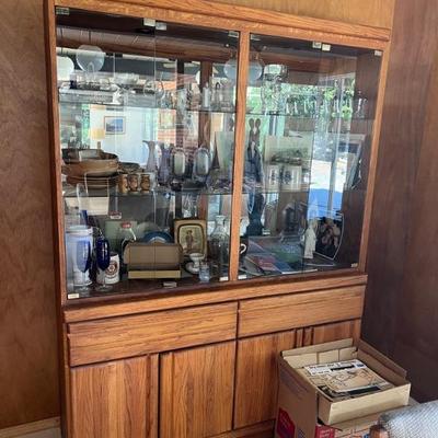 OAK DISPLAY CABINET WITH LIGHTS AND STORAGE AVAILABLE NOW...

