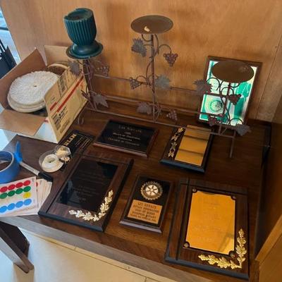 plaques, a candle and awards