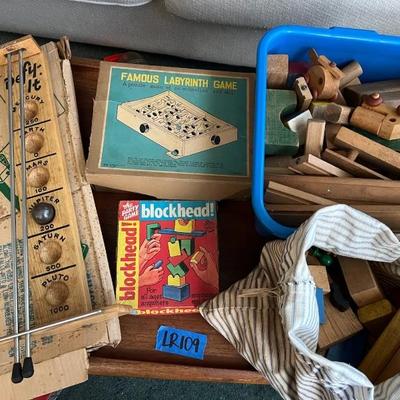 https://ctbids.com/estate-sale/34519/item/3877337/Vintage-Blocks-And-Wooden-Games