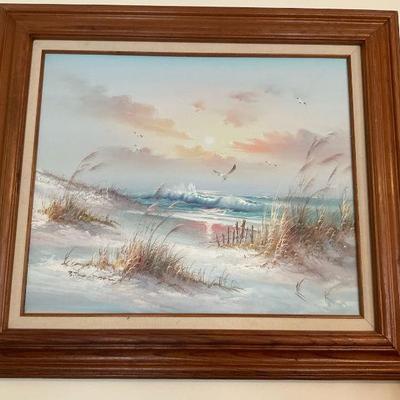 Framed beach scene painting