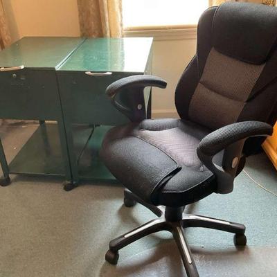 Green metal rolling file cabinets and black office chair