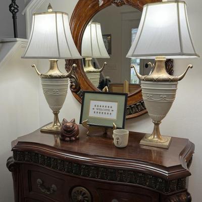 Pair of Neo- Classical solid heavy brass and porcelain lamps by Chapman. Original flame finials. 