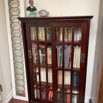 2 matching dark wood cabinets with glass sliding. Doors-33x53