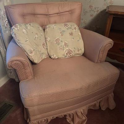 Pair of light pink upholstered swivel chairs
