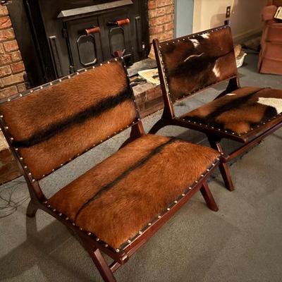 Matching pr of fur upholstered mcm style chairs