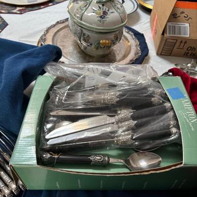 Several patterns of flatware, silver-plate and stainless.