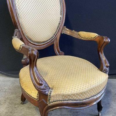 Antique Upholstered Parlor Chair On Casters
