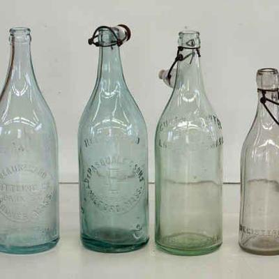 (4) Tall Capped Bottles
