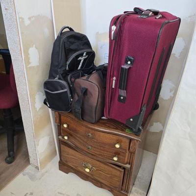 Red suitcase is sold