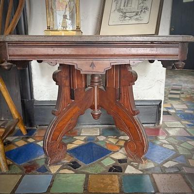 Antique Eastlake marble-top dining table