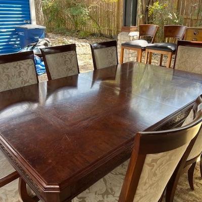 Gorgeous dining table reduces to a square/8 chairs