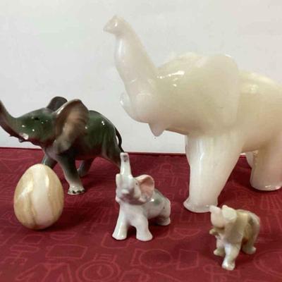 Elegant Stone Elephants And An Egg
