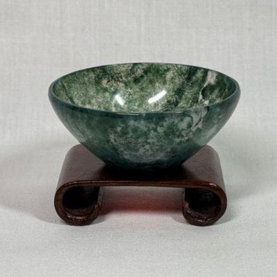 Carved Spinach Jade miniature bowl on wood stand, 2 1/4” diameter