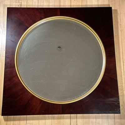 CIRCULAR WALL MIRROR | Large round mirror with gilt border in large square black frame. - h. 42.25 x w. 42.25 in

