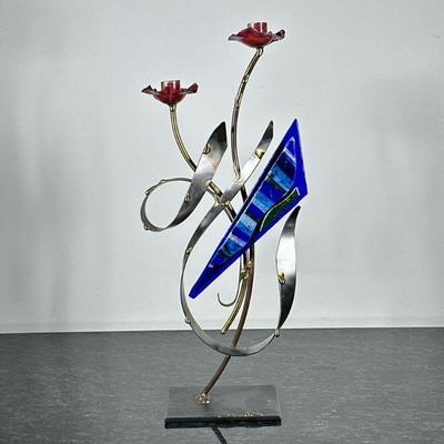 GARY ROSENTHAL FLOWER CANDLESTICKS | Flower-form mixed metal candlestick with colored glass. - h. 18 x w. 8 x d. 4 in

