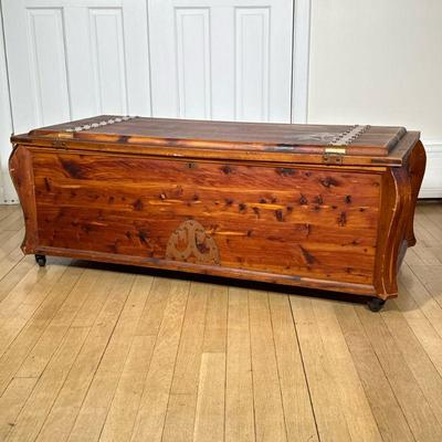 WOODEN CHEST | Carved wood chest with riveted metal hands on top, on wheels. - h. 18 x w. 48 x d. 22.5 in