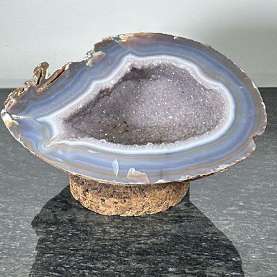 LARGE GEODE | Large, heavy geode in shades of gray and blue potentially amethyst or agate, includes cork stand. - h. 8 x w. 12 x d. 13 in...