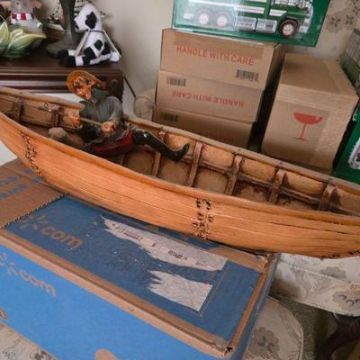 Sale Photo Thumbnail #87: Vintage Wooden Rowboat with Figurine
- A detailed hand-crafted wooden rowboat with a fisherman figurine adds a rustic, nautical touch to your home. This vintage piece is a great conversation starter for lovers of boating, historical collectibles, or coast