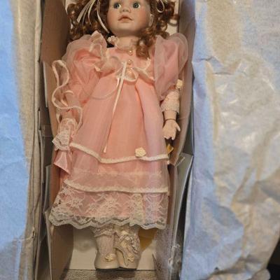 Doll in Box
- A charming, collectible doll dressed in a delicate pink gown. This doll comes with a beautifully designed porcelain face,...