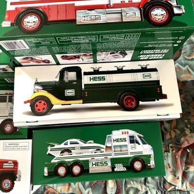 This listing features a collection of vintage Hess toy trucks, each preserved in its original box with vibrant graphics and minimal wear....