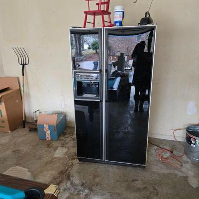 Sleek Black Refrigerator
•	Upgrade your kitchen or utility room with this sleek, black side-by-side refrigerator. With ample storage...